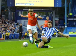 Harry Cornick trying to whip in a cross but Kieran Lee gets a block in