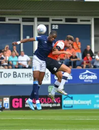 Harry Cornick battles with Terence Kongolo in the air