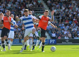 James Collins and Ryan Manning battle for a loose ball in the box