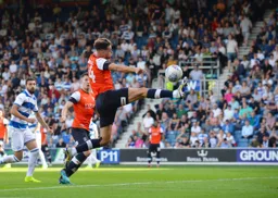 Harry Cornick trying to latch onto a cross, he does, which sets up James Collins to make it 3-2