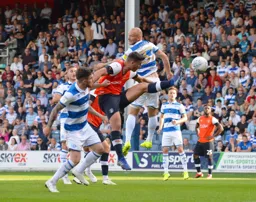 Matty Pearson latches onto a cross as Toni Leistner watches on