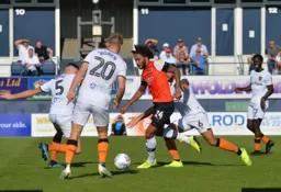 Izzy Brown tries to progress the ball forward but is crowded out by the Hull players