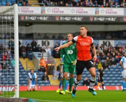 James Collins points to the ball in the back of the net after firing the Town in front from a pinpoint Izzy Brown cross in the 17th minute