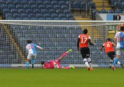 Simon Sluga gathers before an onrushing Bradley Dack can get to the ball