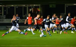 James Collins about to send in a shot, everyone is ready for a rebound