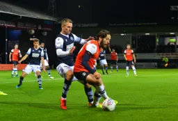 Jacob Butterfield keeps possession during the Luton Town attack