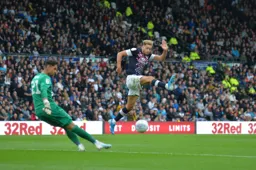 Harry Cornick puts pressure on Derby keeper Kelle Roos