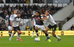 Izzy Brown powers through the midfield, leaving Krystian Bielik in his dust
