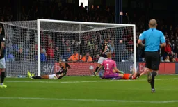 It's 3-0 to the Town. Ashley Williams turns the ball into his own net under pressure from James Collins