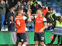 James Collins congratulates Ryan Tunnicliffe for sending in the ball that made it 3-0 to the Town