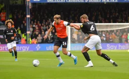 Harry Cornick trying to get away from Nathan Baker