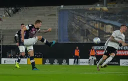 James Collins rifles in a shot