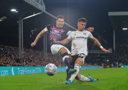 James Collins trying to get a cross in against Joe Bryan who has won this battle