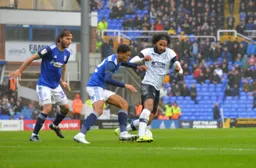 Izzy Brown keeps the ball away from Jude Bellingham