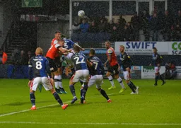 Matty Pearson and James Collins battling for the ball from a corner against Tobias Figueiredo