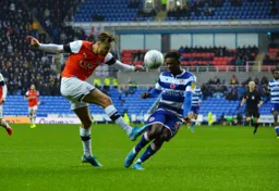 Harry Cornick's attempted cross is closed down by Omar Richards