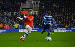 Luke Bolton cuts in from the wing and has Omar Richards in pursuit
