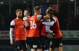 Pelly-Ruddock Mpanzu gets congratulated by his teammates after a spectacular shot levelling the match at 1-1