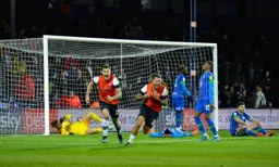 George Moncur and James Collins are jubilant that we've turned this game around. The Wigan players are inconsolable