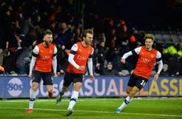 Callum McManaman celebrates another vital goal for the Hatters