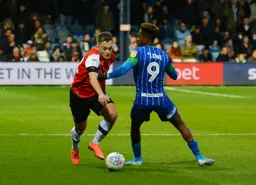 Luke Bolton breezes past Jamal Lowe