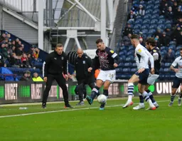 James Collins gets some motivation from Graeme Jones as he tries to keep the ball in play