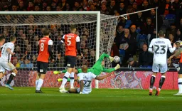 It's a tremendous save from Simon Sluga to deny Andre Ayew