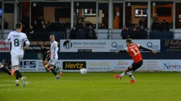 Andrew Shinnie has a pop from distance