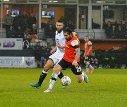 Jacob Butterfield keeping possession in the middle of the park