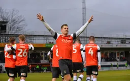 James Collins celebrating in front of the Main Stand after restoring the Hatters lead
