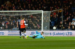 Simon Sluga in full sweeper keeper action, clearing the ball before Ivan Cavaleiro can latch on
