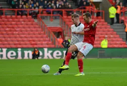 James Bree sending in a cross with Ádám Nagy trying to challenge