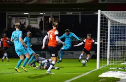 It's a nightmare for Jayden Bogle, but delight for the Town fans, as he turns a cross into his own net, making it 3-2 to the Hatters