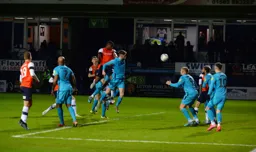 Donervon Daniels rises highest to score his only Luton goal, making it 2-1 to the Hatters