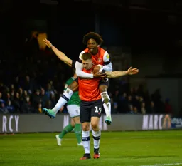Pelly-Ruddock Mpanzu and James Collins celebrate the goal that would seal the three points for the Hatters