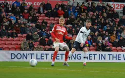 Ryan Tunnicliffe watching his effort go in