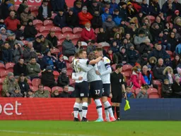 The players celebrate Ryan Tunnicliffe's goal against a relegation rival