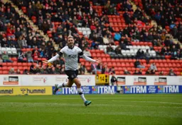 Harry Cornick celebrates after levelling for the Hatters at The Valley