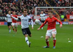 Callum McManaman competing for a ball against future Hatter Alfie Doughty
