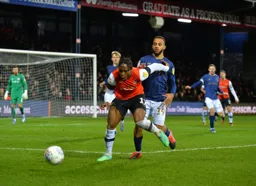 Pelly-Ruddock holding off Bryan Mbeumo as the Town build an attack