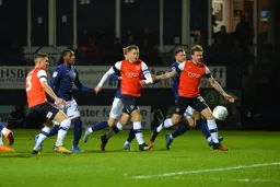 Shandon Baptiste watching the ball as it goes into his own net putting the Town 1-0 ahead in the 9th minute