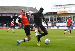 Harry Cornick trying to pinch the ball from Bruno Martins Indi
