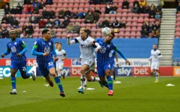 Harry Cornick battling with Nathan Byrne