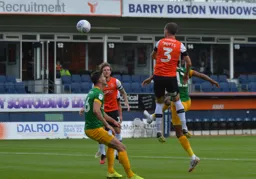 Dan Potts rises highest for the corner