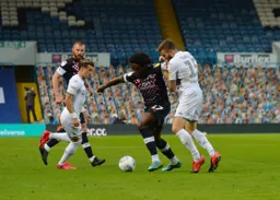 Pelly-Ruddock Mpanzu drives through holding off Stuart Dallas