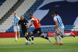 Elliot Lee drives forward with the ball