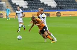 Luke Berry battles with Kevin Stewart for the ball