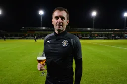 Nathan Jones raises a toast, happy with his accomplishment of grabbing survival with nine games left upon arriving back at the club