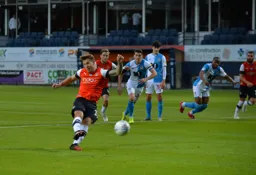 James Collins slots home a penalty, making it 3-1 to the Hatters