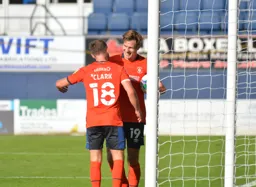 James Collins makes sure he has the match ball after scoring his and Town`s third goal